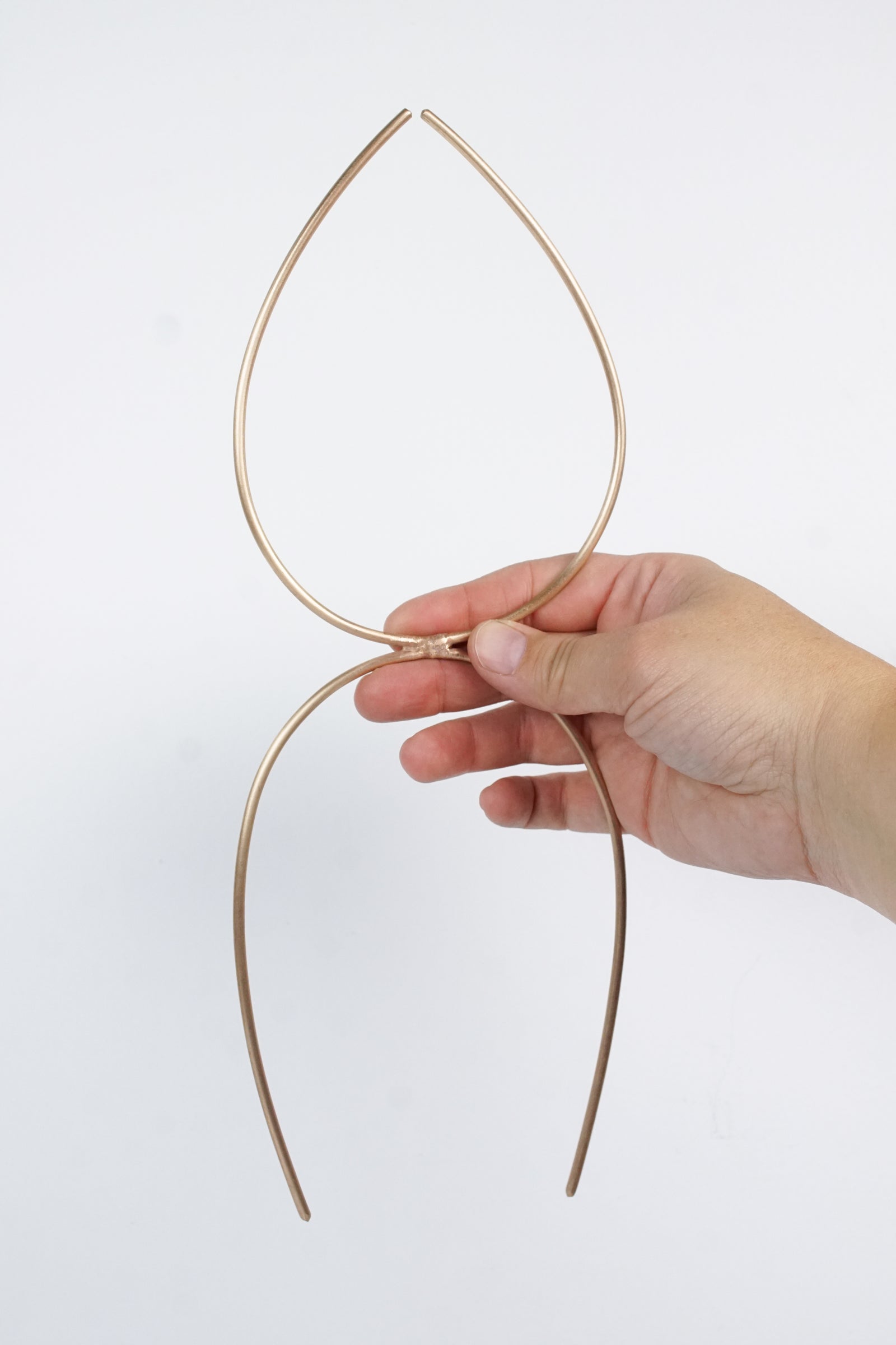 Bronze plant stake indoor trellis with mini monstera plant