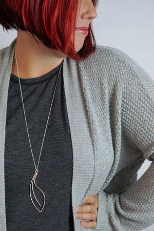 Fleur long necklace in black steel, silver, or bronze