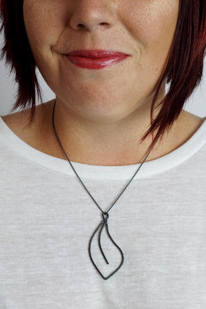 Flourish Necklace in black steel, silver, or bronze